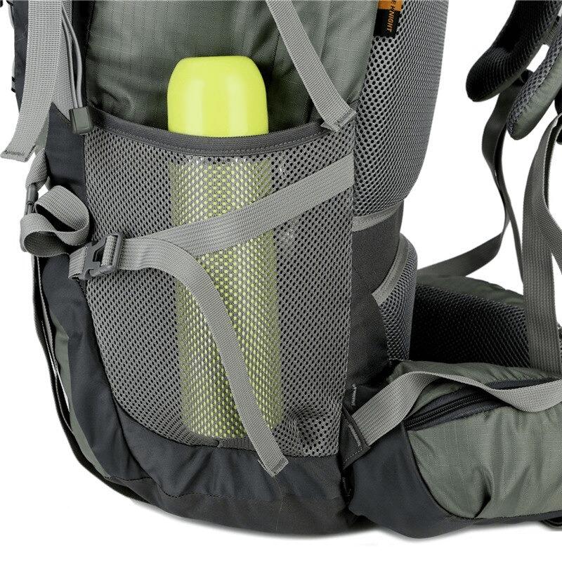 Close-up of hiking backpack with side mesh pocket and water bottle, showcasing durable fabric and adjustable straps for outdoor adventures.