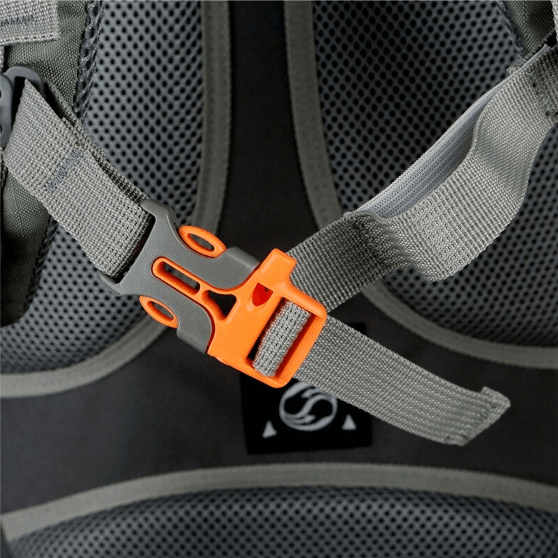 Close-up of hiking backpack's adjustable strap with a vibrant orange buckle, showing its solid construction and attention to detail.