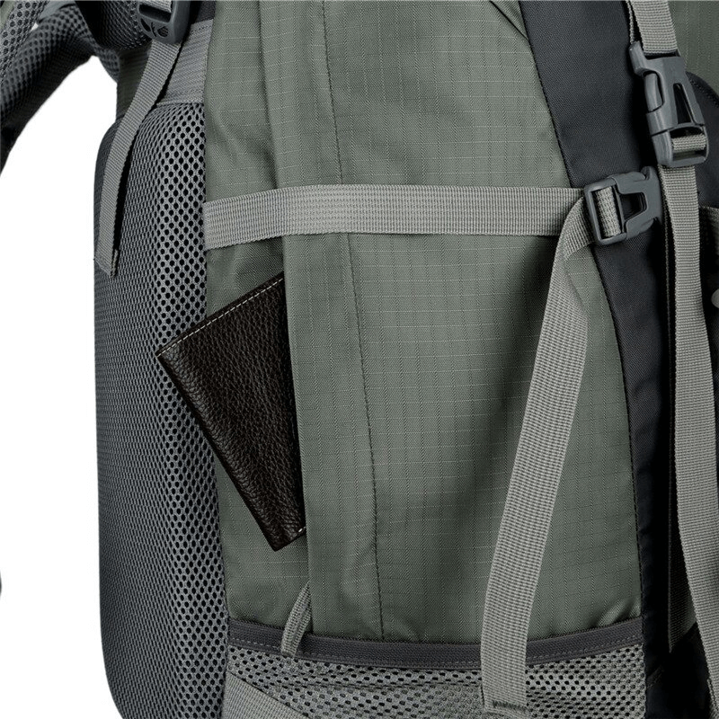 Close-up of green hiking backpack showing side pocket with mesh and adjustable straps, ideal for outdoor adventures. Model SF0296.
