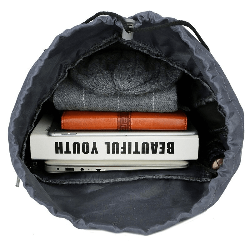 Interior view of Hiking Large Capacity Water Resistant Backpack SF0296, showing storage space with books, clothes, and a laptop.
