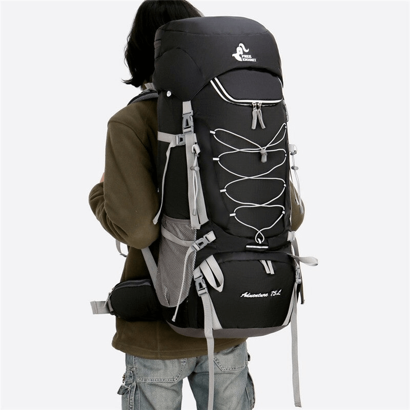 Back view of person wearing a large capacity water-resistant hiking backpack with rain cover, ideal for outdoor adventures.