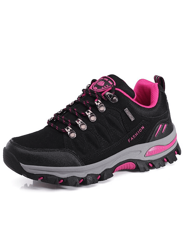 Stylish black and pink women's hiking shoe with durable rubber outsole and lace-up closure perfect for mountaineering.