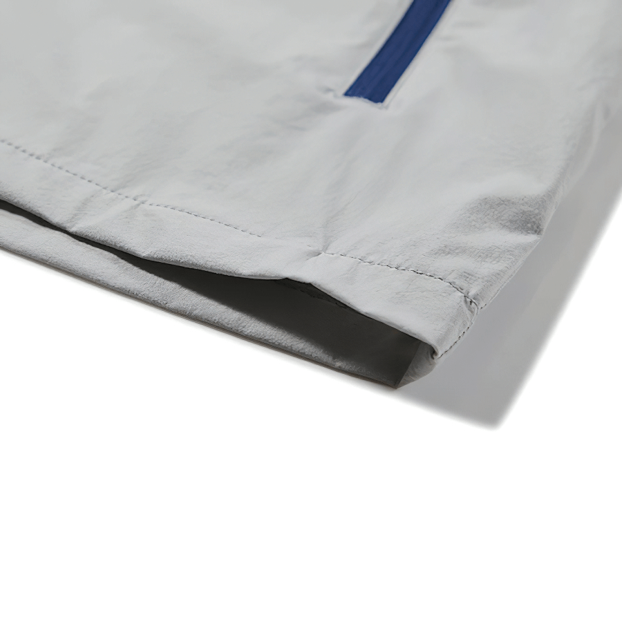 Close-up of the grey Hiking Sun-Protective Windproof Jacket showing the blue zipper detail and durable stitching.