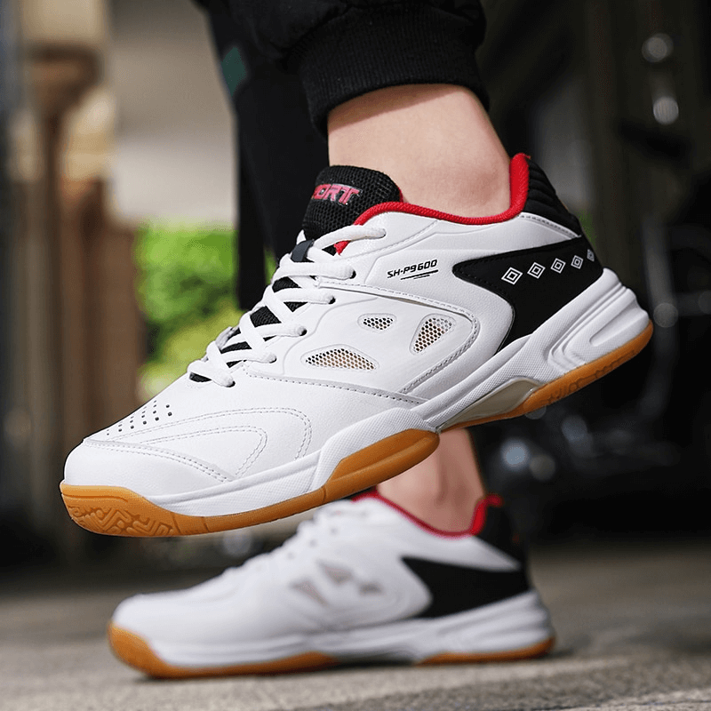 Stylish lace-up flexible tennis shoes with breathable design, showcasing superior traction sole. Perfect for active sports enthusiasts.