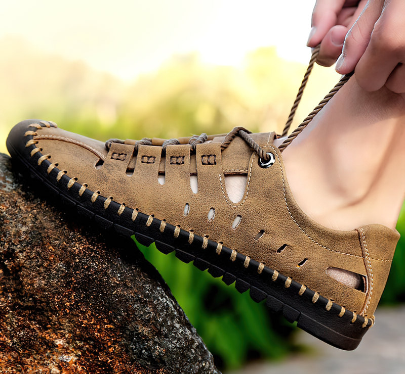 Men's lace-up leather outdoor water shoes on a rock; durable, comfortable, perfect for adventure.