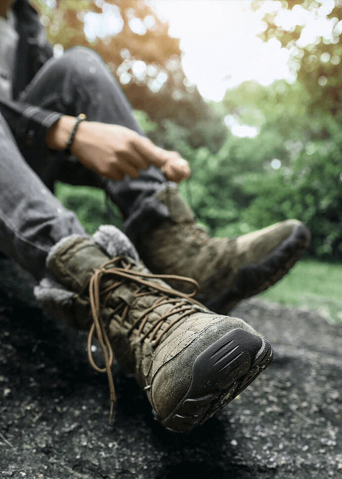 Lace-up waterproof mid-calf snow boots with fur in outdoor setting, featuring non-slip rubber outsoles and cozy plush lining for winter.