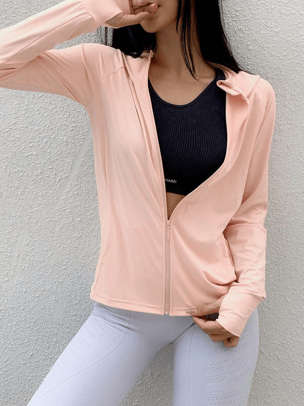 Woman modeling a pink ladies zipper thin sports hoodie with thumb holes, designed for quick-dry and high-performance running.