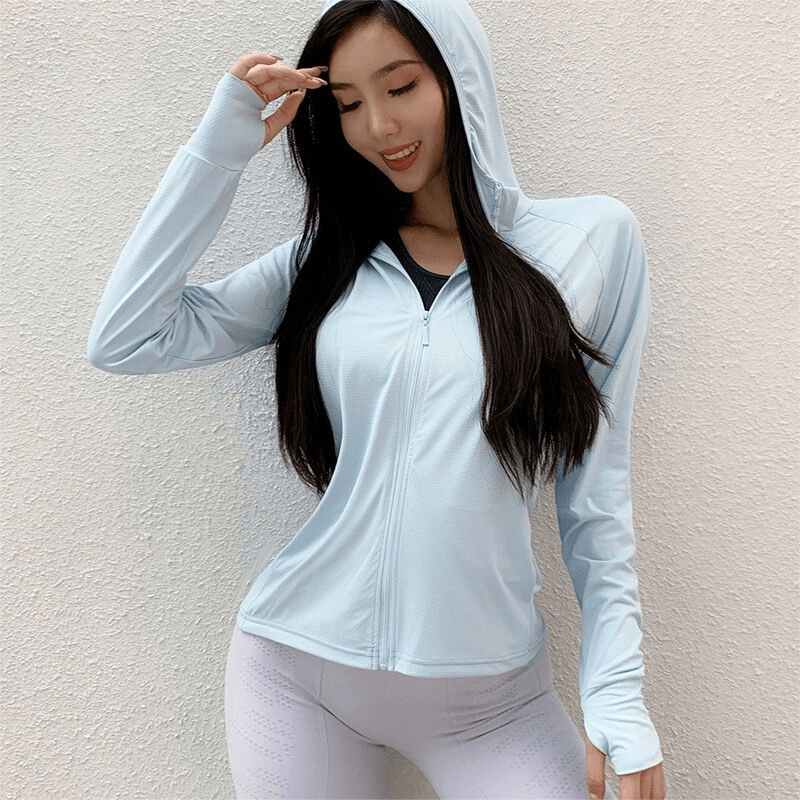 Woman wearing blue Ladies Zipper Thin Sports Hoodie with thumb holes, ideal for running and fitness. Quick-dry and breathable design.