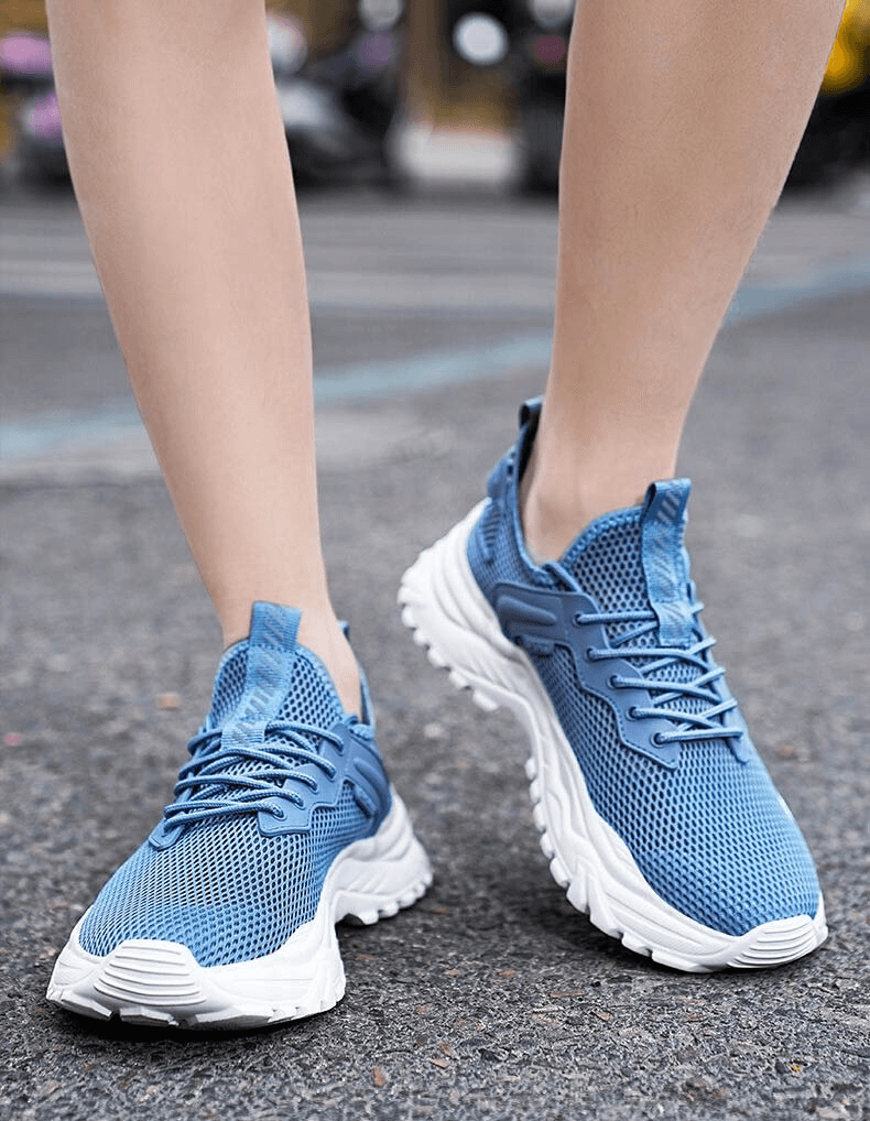 Light blue breathable sports sneakers with cushioning, perfect for running. Featuring lace-up closure and EVA cushioning.