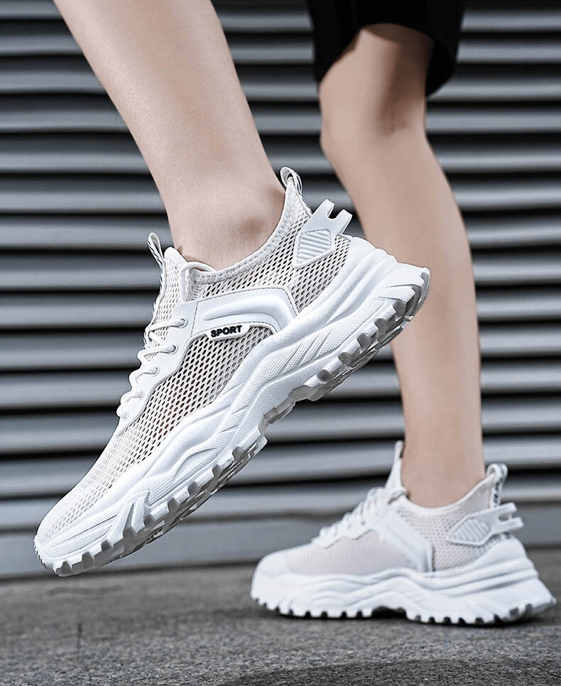 White breathable sports sneakers with cushioning for men, featuring air mesh upper and EVA shock absorption, stylish running shoes.