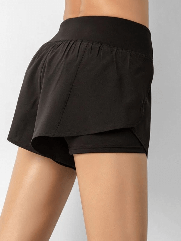 Women's lightweight quick dry black sports shorts with elastic waistband, perfect for movement and comfort in athletic activities.