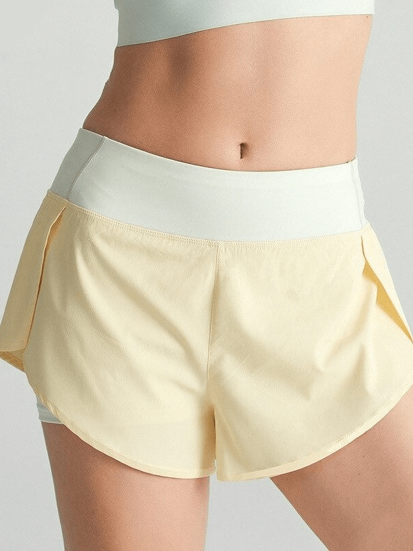 Yellow lightweight elastic quick-dry shorts for women, featuring a comfortable waistband and breathable fabric for sports activities.