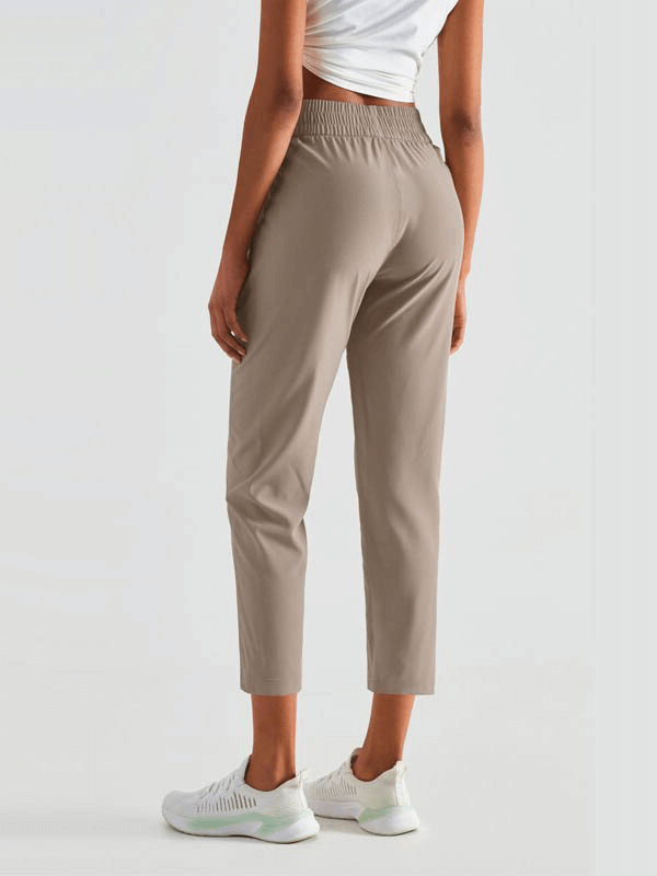 Back view of lightweight high waist fitness workout sweatpants with pockets, showcasing elastic waistband and breathable material.