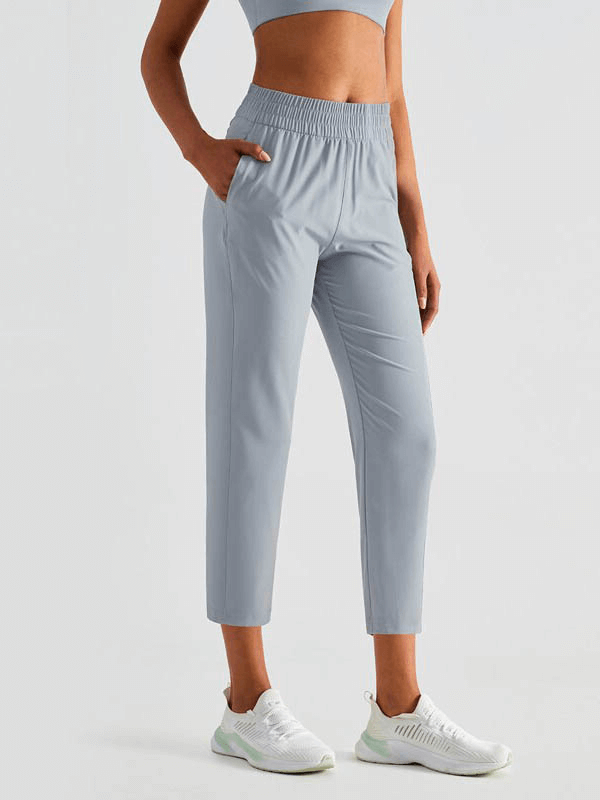 Lightweight high waist fitness workout sweatpants with pockets, ideal for yoga, made of breathable, quick-dry nylon and spandex.