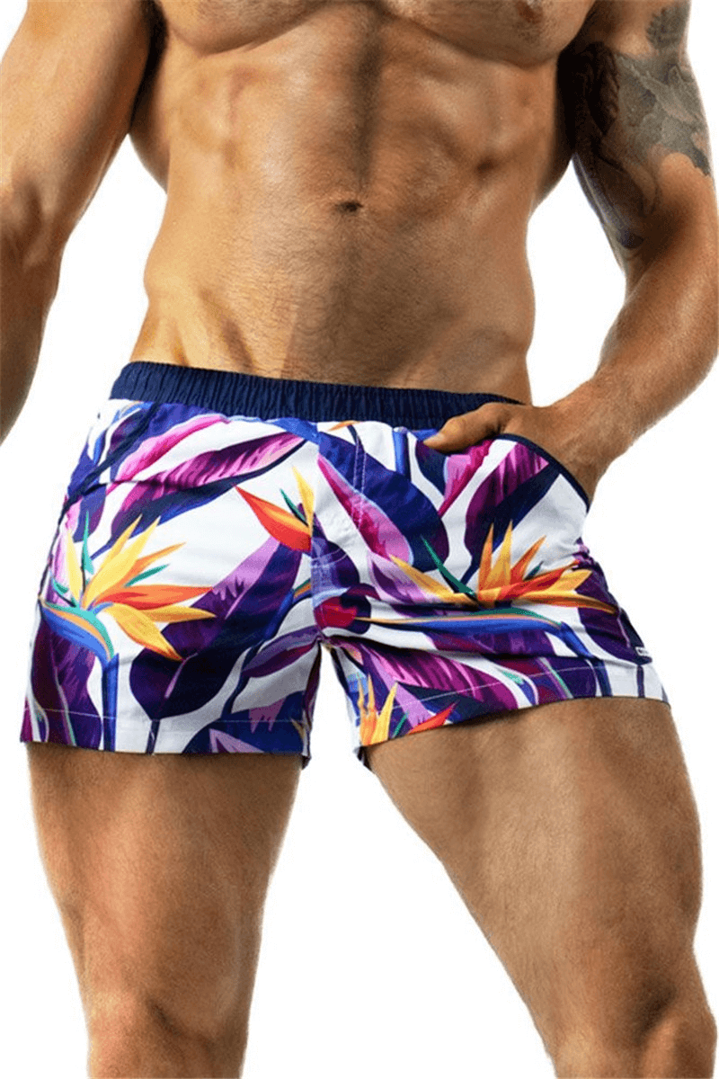 Men's lightweight quick-drying fitness shorts with tropical print, perfect for running and sports. SF1150 model showcasing vibrant design.