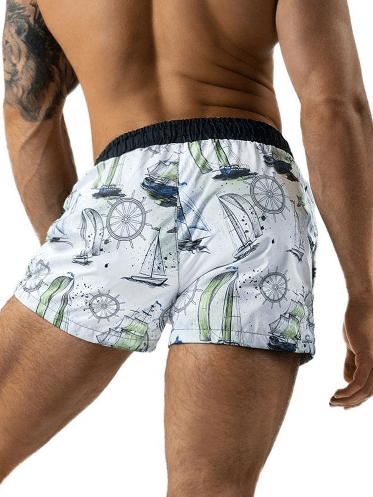 Man wearing lightweight quick-drying sports fitness shorts with a nautical print, showing the back view, ideal for active lifestyle.