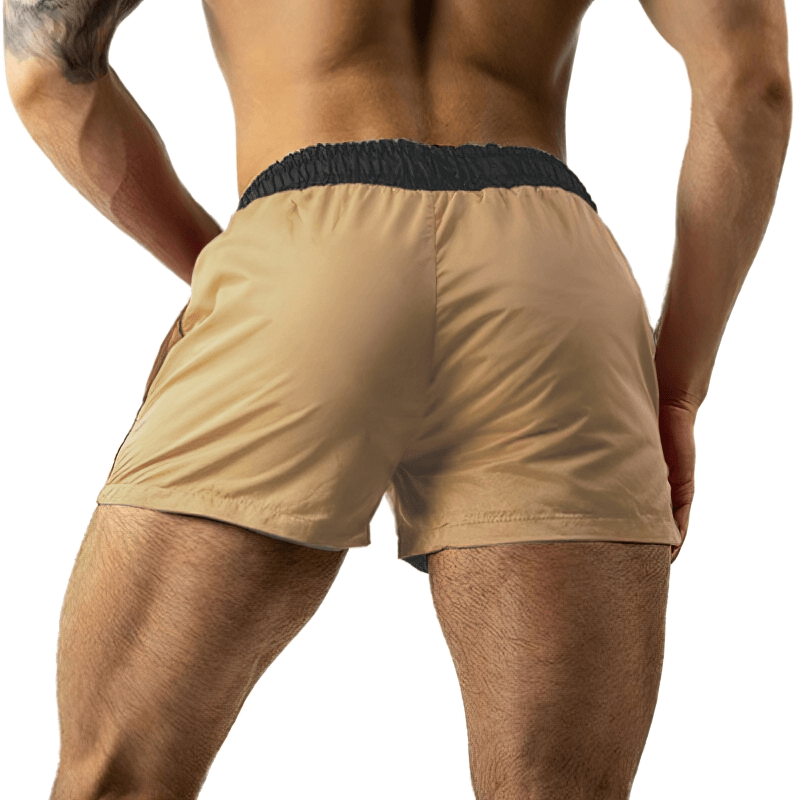 Back view of man wearing beige lightweight quick-drying sports fitness shorts designed for active lifestyle, model SF1150.