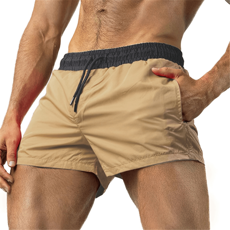 Man wearing lightweight quick-drying sports fitness shorts for outdoor activities, showcasing durable design and comfort.