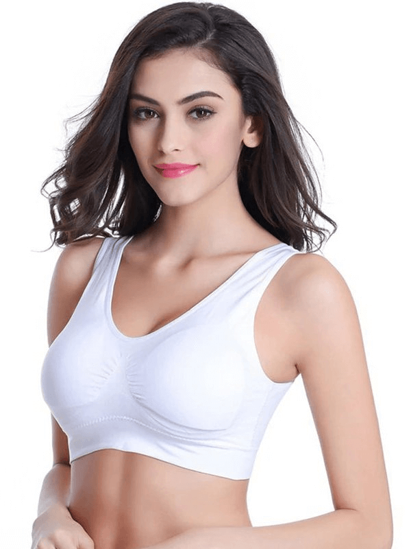Lightweight solid color women's sports bra for fitness, featuring white seamless design and wire-free support.