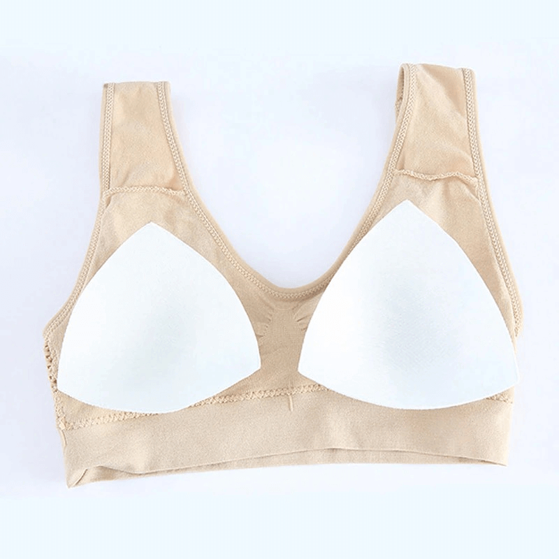 Lightweight solid color women's sports bra with padded, wire-free design and seamless construction for fitness and comfort.