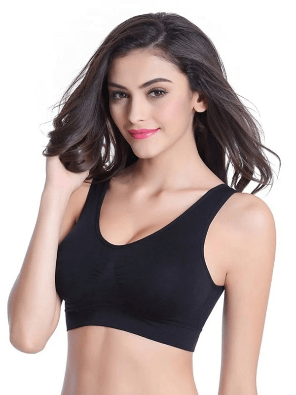 Model wearing black lightweight women's sports bra for fitness, showing seamless design and comfort fit.