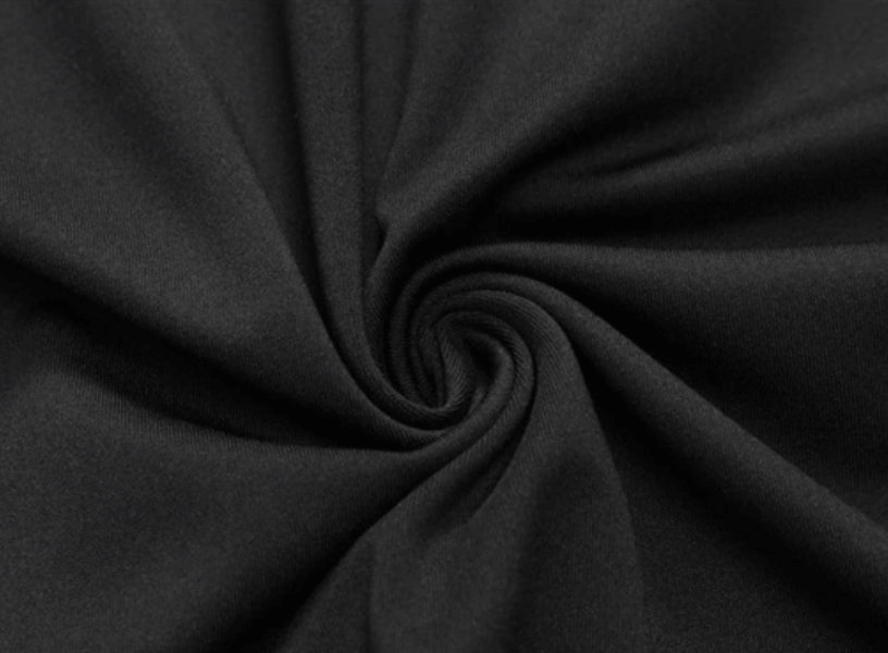 Close-up of black polyester-spandex fabric used in lightweight sports compression men's shirts offering breathability and elasticity.