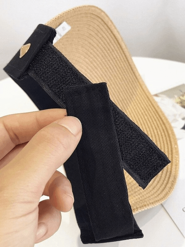 Close-up of a lightweight straw summer hat with adjustable fastener, ideal for sun protection and casual outdoor wear.