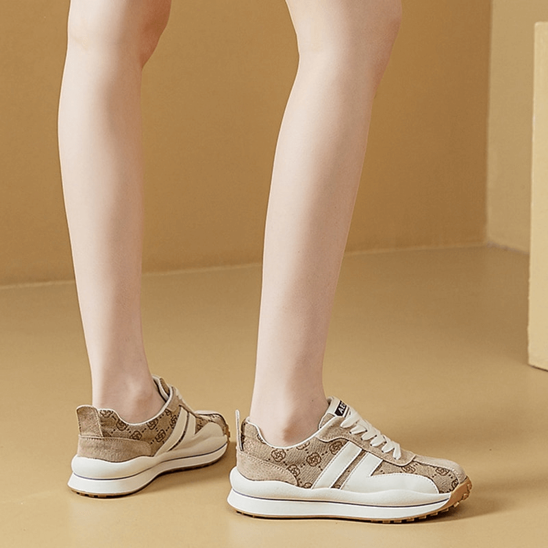 Cozy genuine leather lace-up ankle flat sneakers with print design, featuring rubber outsole and cotton lining for comfort and style.