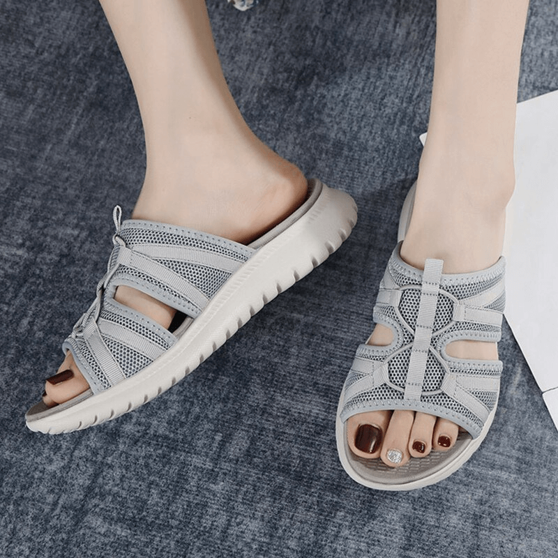 Pair of lightweight waterproof athletic soft flat slippers for women, featuring breathable design and durable sole, perfect for active wear.