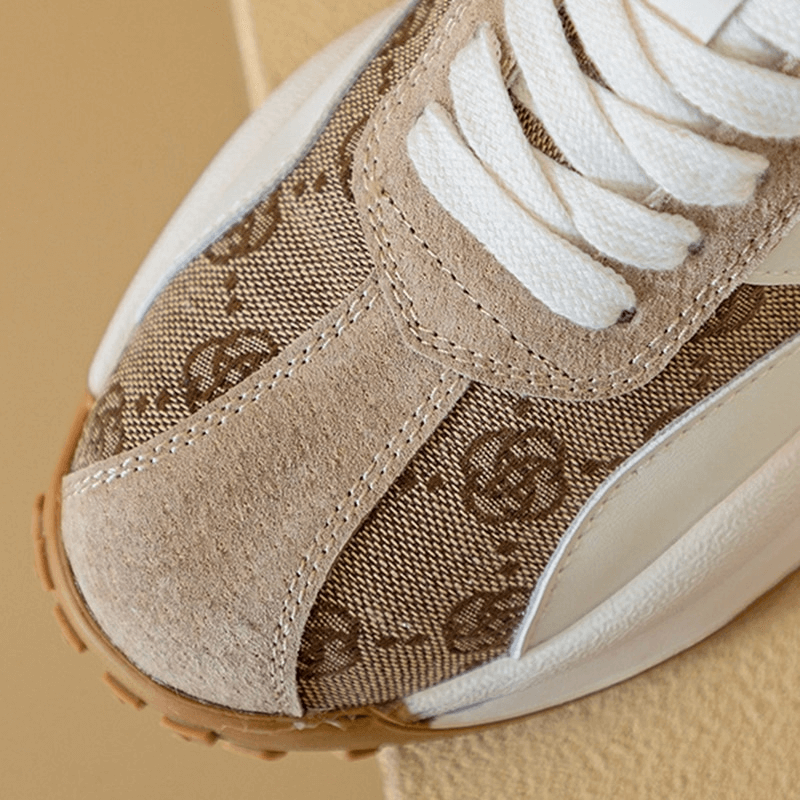 Cozy genuine leather lace-up ankle sneakers with printed design, featuring white laces and rubber outsole for durable wear.