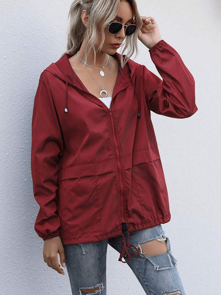 Woman wearing a red lightweight waterproof sport windbreaker jacket with hood, SF1168