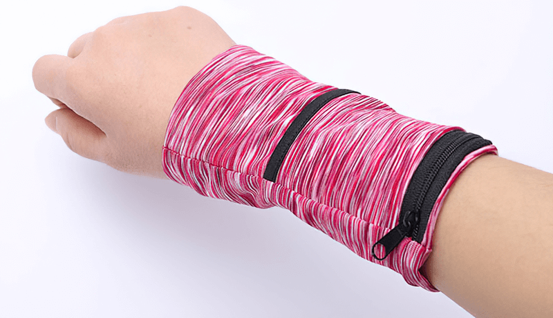 Person wearing pink lightweight running arm bag with zipper, perfect for phone and keys.