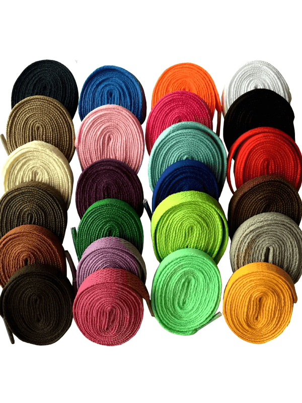 Colorful assortment of long plain flat shoelaces for sports shoes, featuring various vibrant colors neatly arranged and rolled up.