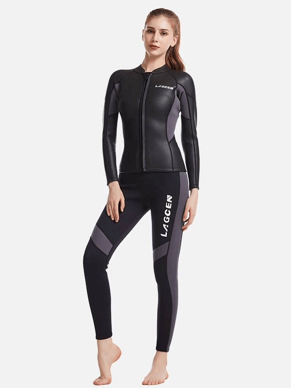 Woman wearing a long-sleeved black neoprene wetsuit for surfing and snorkeling, showcasing style and comfort.
