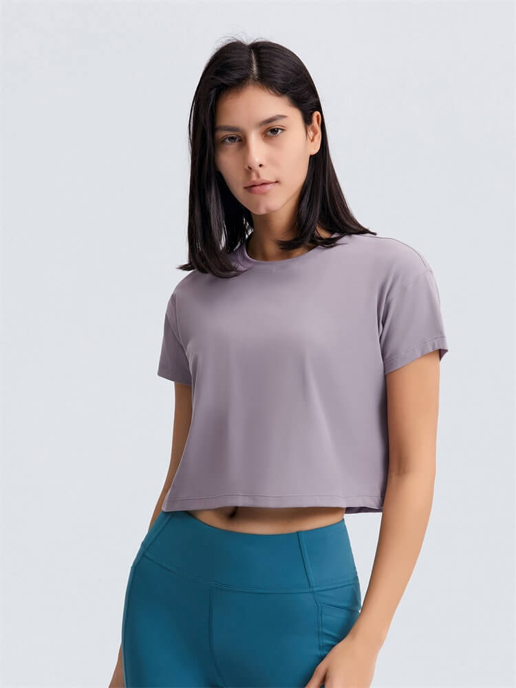 Loose Fit Workout Solid Crop T-shirt for Women in gray, ideal for yoga with short sleeves, shown on female model. SF1155