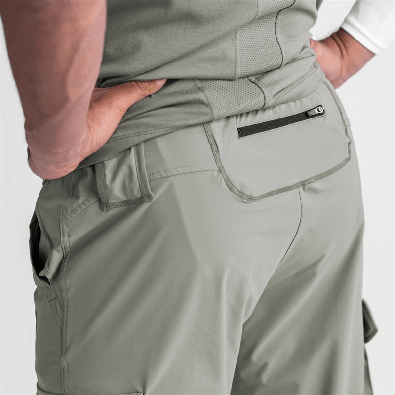Close-up of men's loose slim elastic joggers with wide cuffs and zippered pocket, perfect for running and exercise.