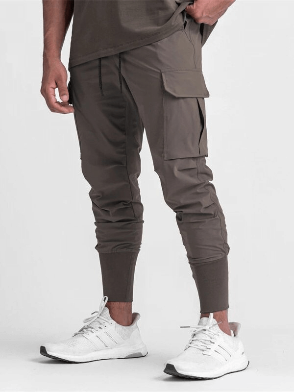 Loose Slim Elastic Joggers Pants for Men with Wide Cuffs, perfect for workout, breathable polyester, comfortable and stylish.