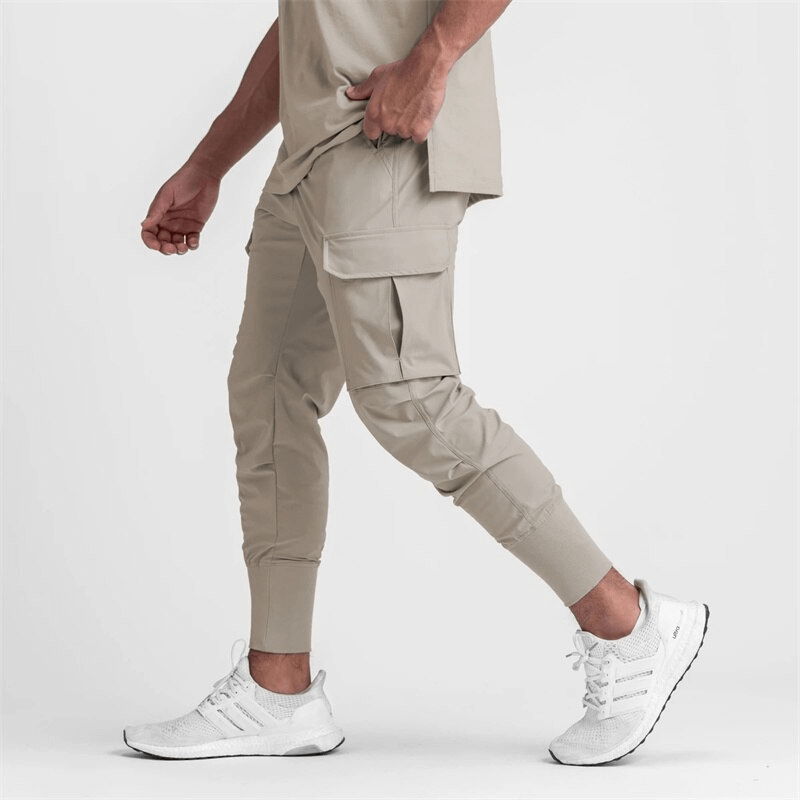 Men's loose slim elastic joggers with wide cuffs, perfect for running and exercise, showcasing comfort and style in beige.
