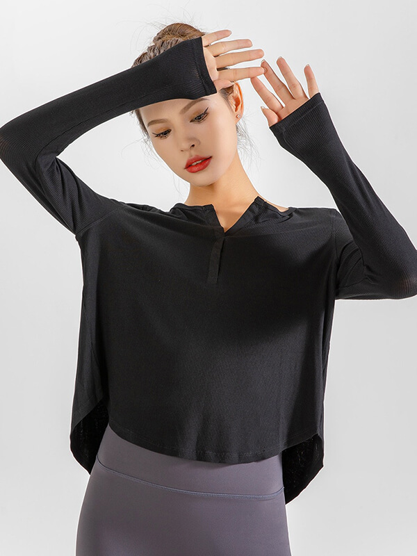 Model wearing black loose v-neck top for women, stylish quick-dry running shirt, perfect for yoga, with long sleeves and breathable fabric.