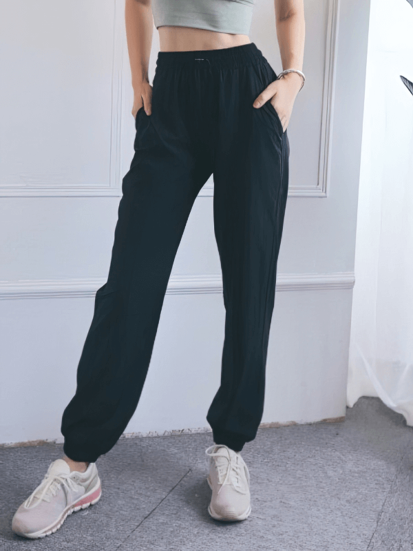 Loose Women's High-Waisted Yoga Training Pants with drawstring, in black, perfect for comfort and style in yoga and leisure activities.