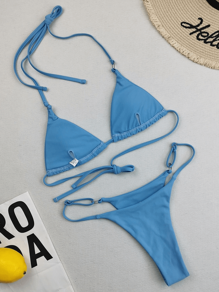Sky blue low waist bikini set for women; features adjustable ties and a sleek Brazilian cut; perfect for beachwear.