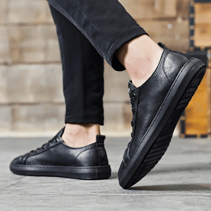 Luxurious black leather walking shoes for men, featuring breathable sheepskin insole and slip-on closure, perfect for casual wear.