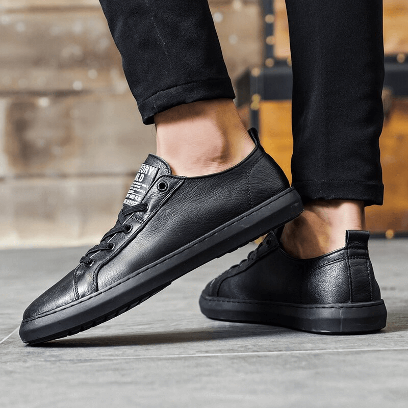 Luxury genuine leather walking shoes for men, casual and breathable, in black with slip-on closure and durable rubber outsole.