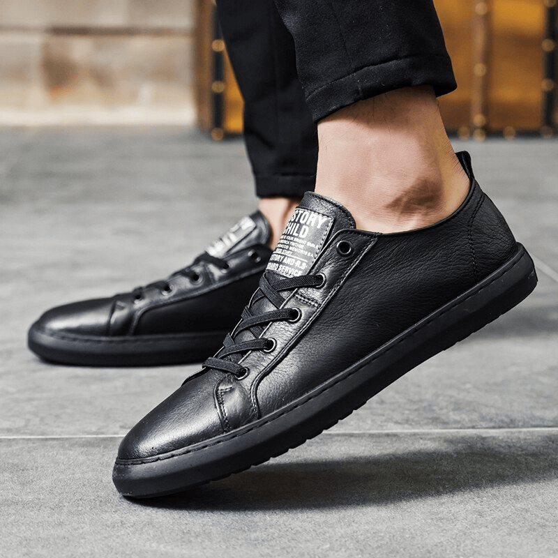 Luxury genuine leather casual walking shoes for men with breathable insole and slip-on design, featuring durable black rubber outsole.