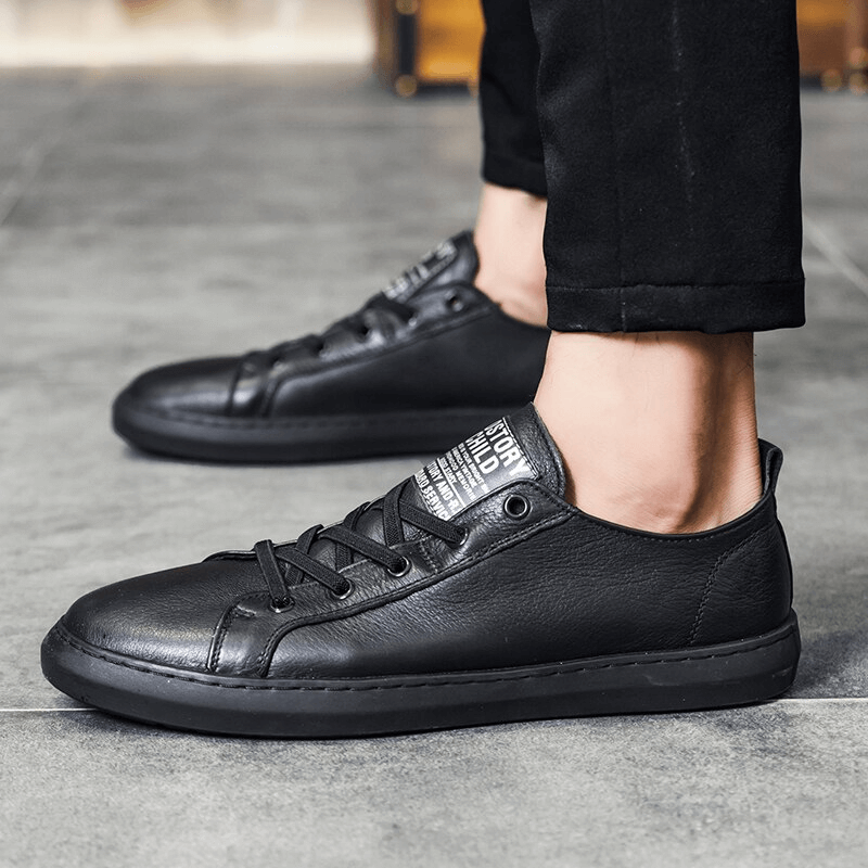 Luxury genuine leather walking shoes for men with breathable sheepskin insole and slip-on closure, showcased on a tiled floor.