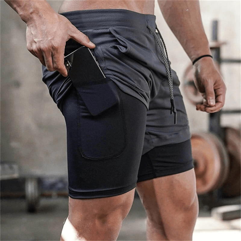 Male double-deck running shorts with pockets, perfect quick-dry gym wear for performance and comfort, featuring a sleek black design.