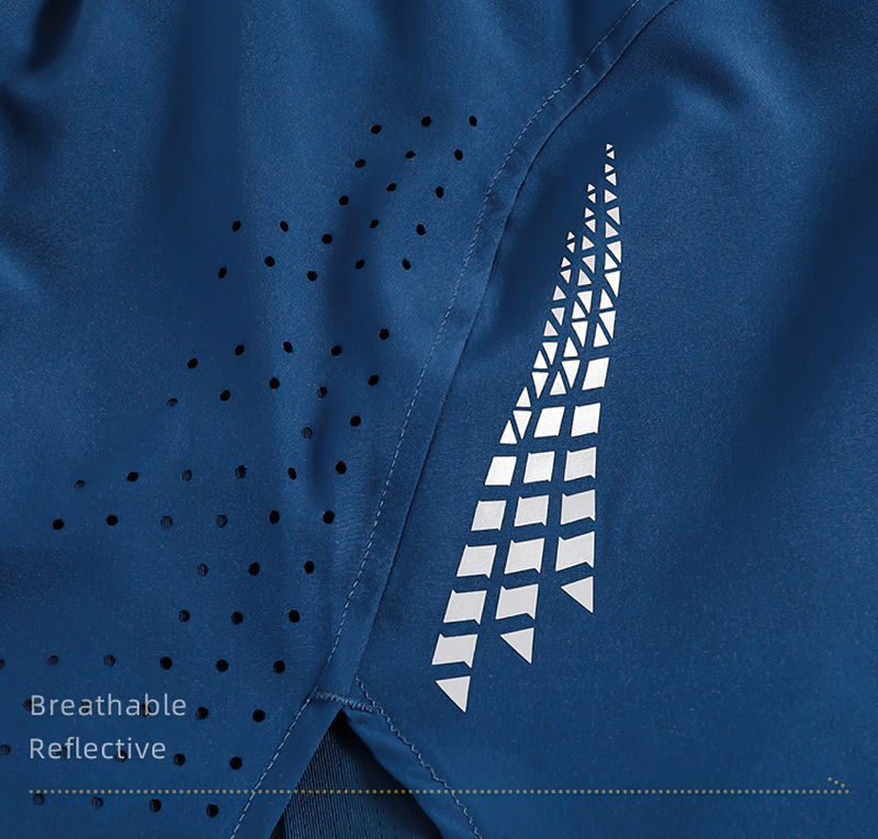 Close-up of male double layer high waist shorts with breathable fabric and reflective design, perfect for running and training.