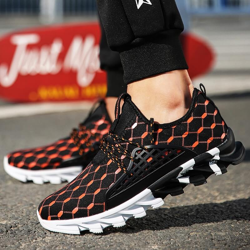 Male mesh running shoes with gingham pattern, black and orange design, providing breathable comfort and lightweight support on pavement.