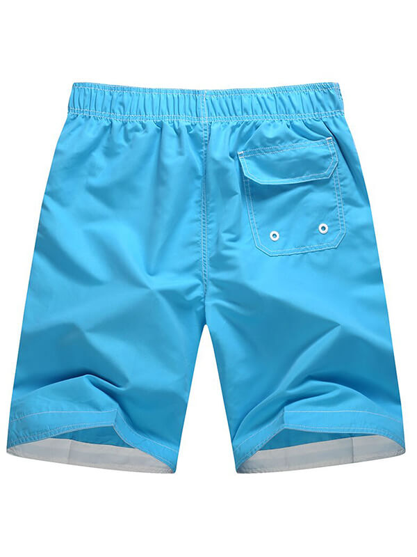 Vibrant blue quick dry boardshorts for surfing, featuring a convenient pocket for beach outings and water sports.