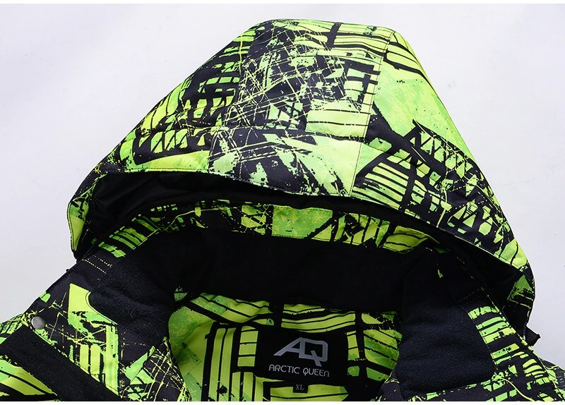 Stylish green and black printed hood of a male ski jacket, featuring windproof and waterproof fabric. Ideal for an active ski season.